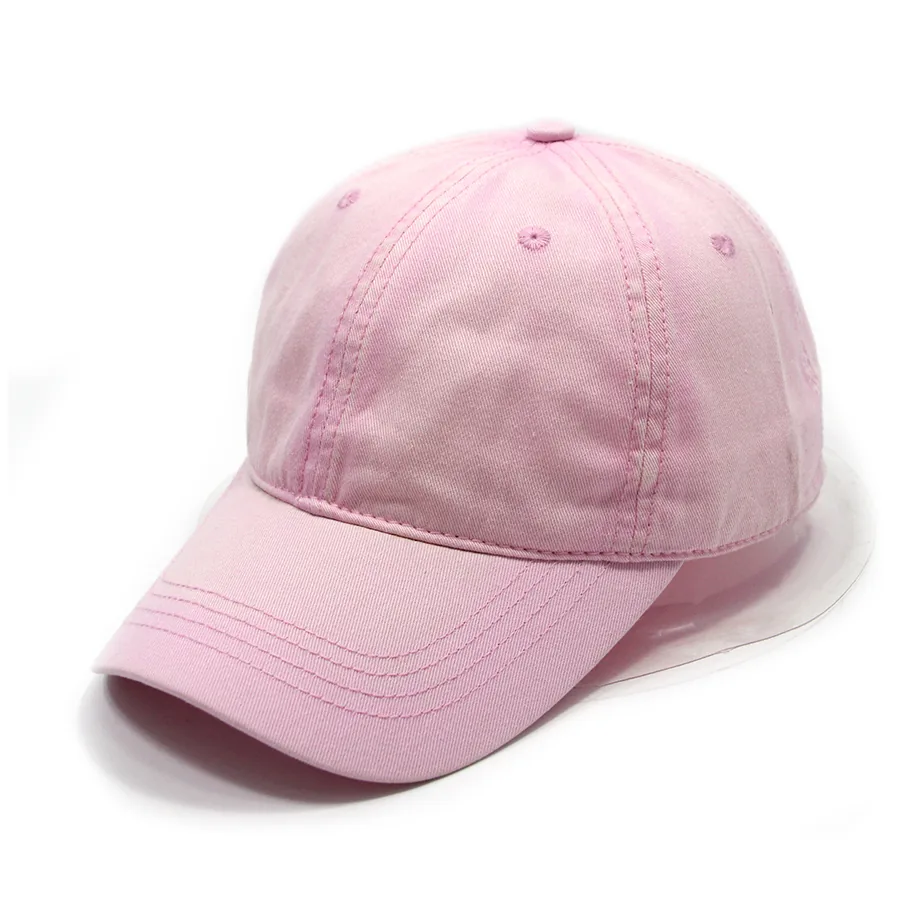Pink curved-brim cap in a three-quarter view, with visible crown seams, eyelets and brim stitching.
