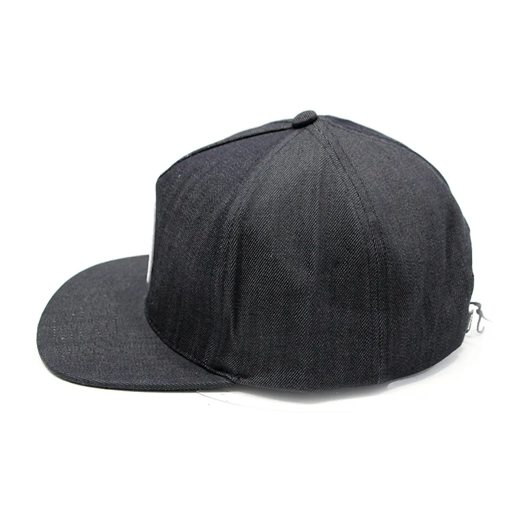 Side view of a dark cap showing a relatively straight brim profile and the crown above it.