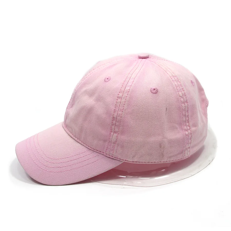 Side view of a pink cap showing the crown profile, side seams and curved brim.