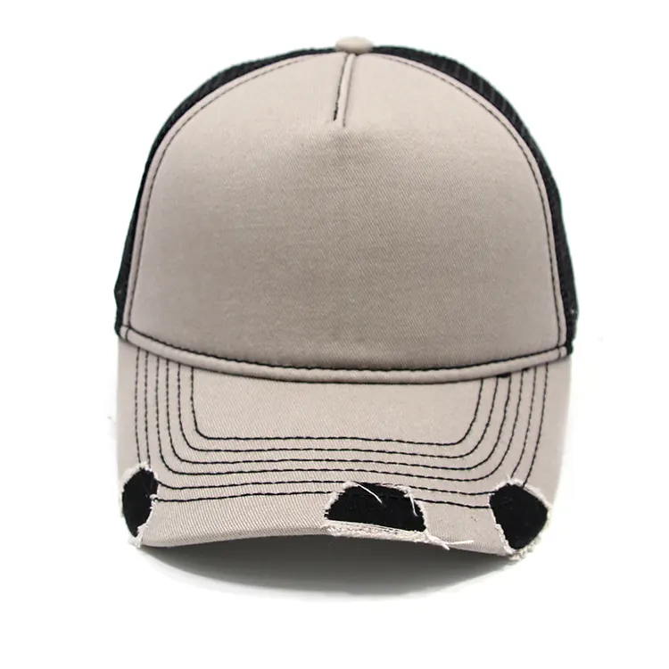 Front view of a trucker cap with a plain light crown, center seam, black mesh visible at the edges and a curved cutout brim.