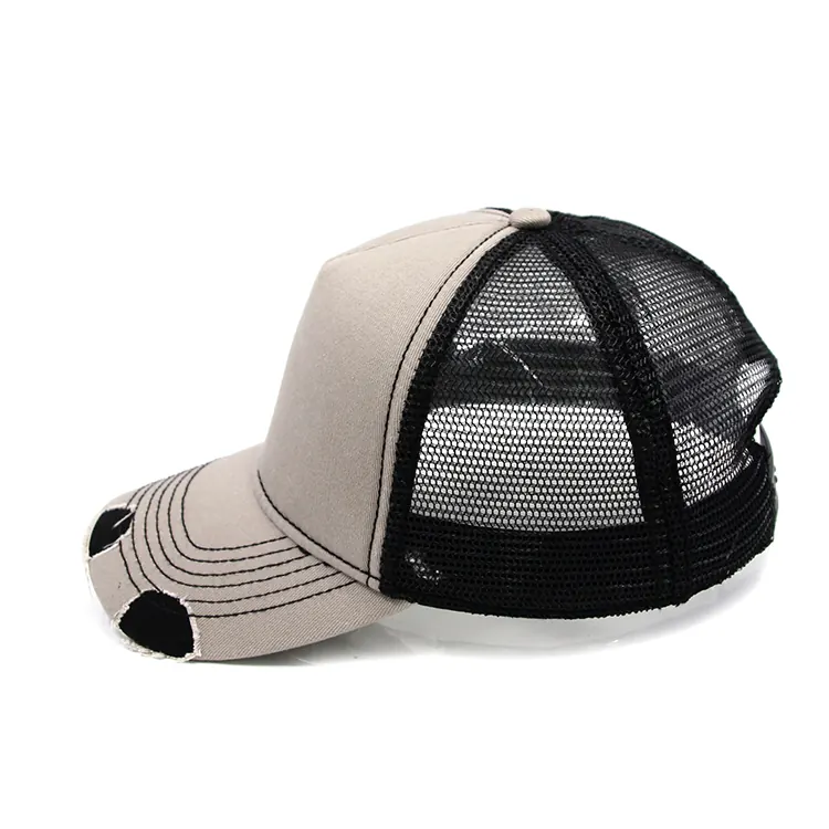 Side view of a light-front trucker cap with black mesh behind the front-to-mesh join and a curved brim pointing left in frame.