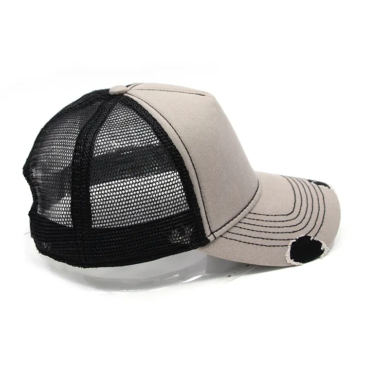 Opposite side view of the light-front trucker cap with black mesh and a curved brim pointing right in frame.
