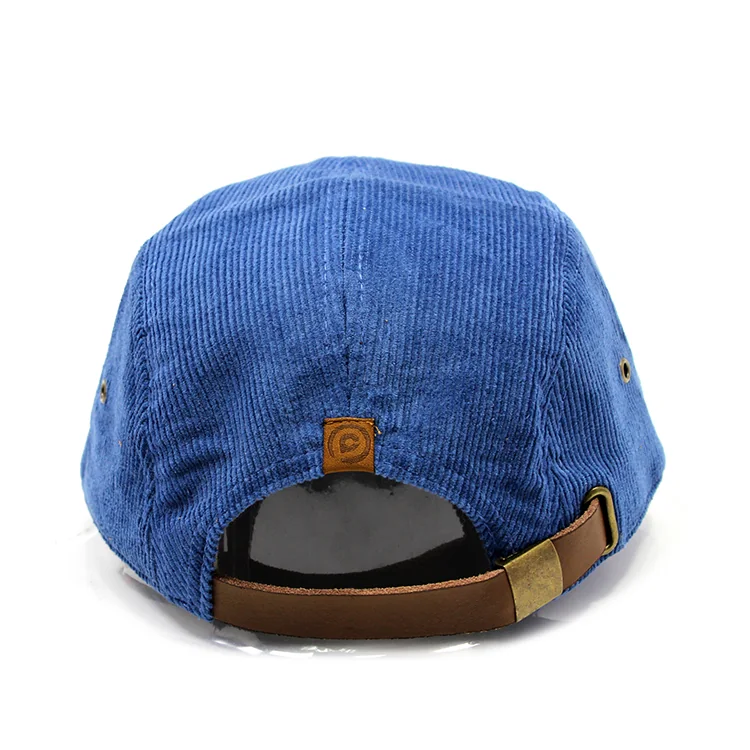 Rear view of the blue camp cap with a brown adjustable strap, metal buckle and small brown rear label.