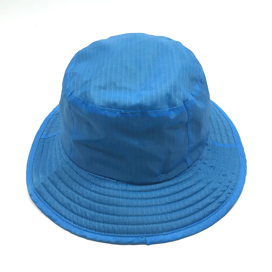 Elevated view of the blue bucket hat showing the top panel, crown shape and all-around brim.