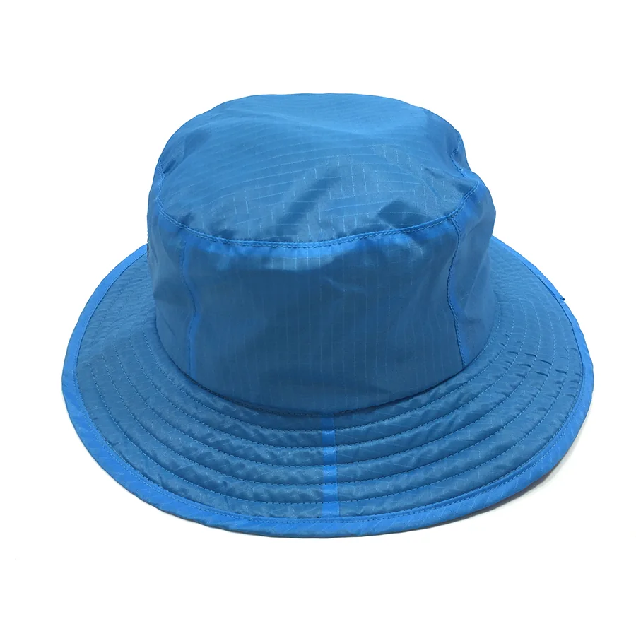Logo-free side view of the blue bucket hat showing the crown seam, checked fabric texture and stitched brim.