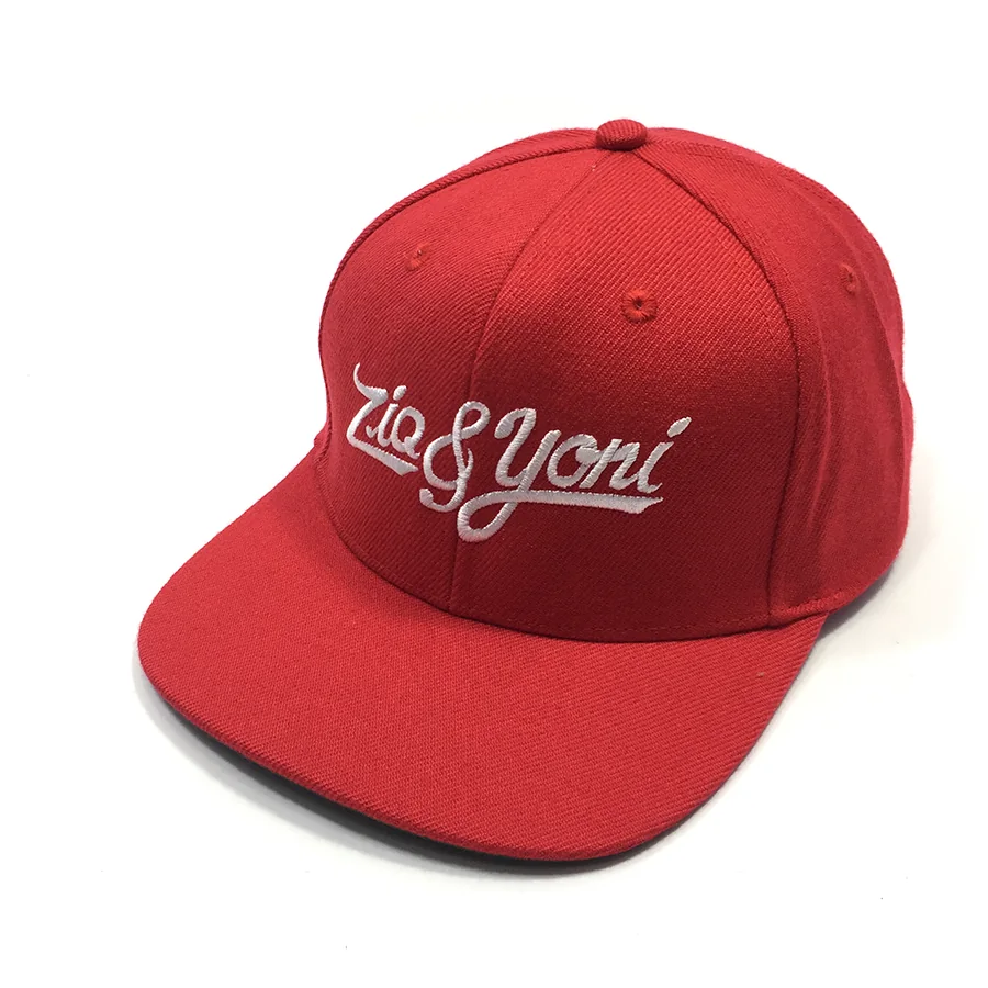 Red flat-brim cap with white script embroidery and a six-panel-style crown.
